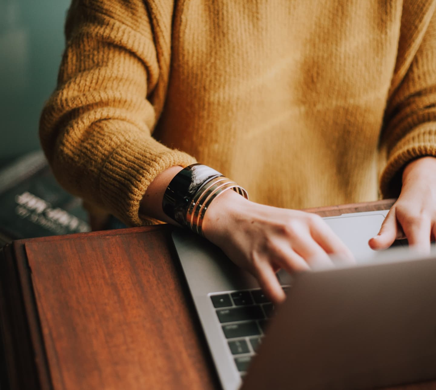 person typing at laptop